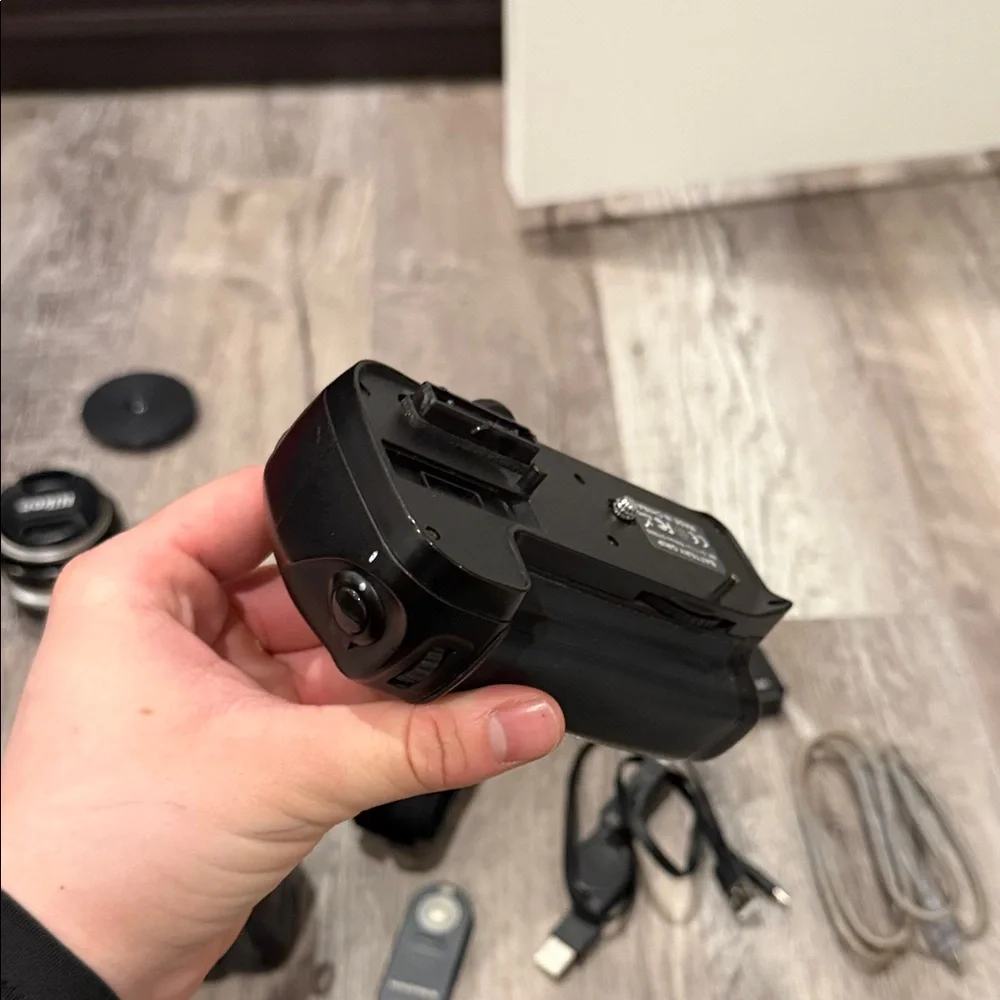 Nikon DSLR D7000 Camera with Black Battery Grip and Accessories